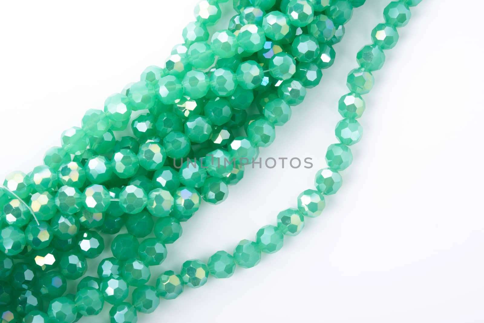 Beautiful Light green Glass Sparkle Crystal Isoalted Beads on white background. Use for diy beaded jewelry