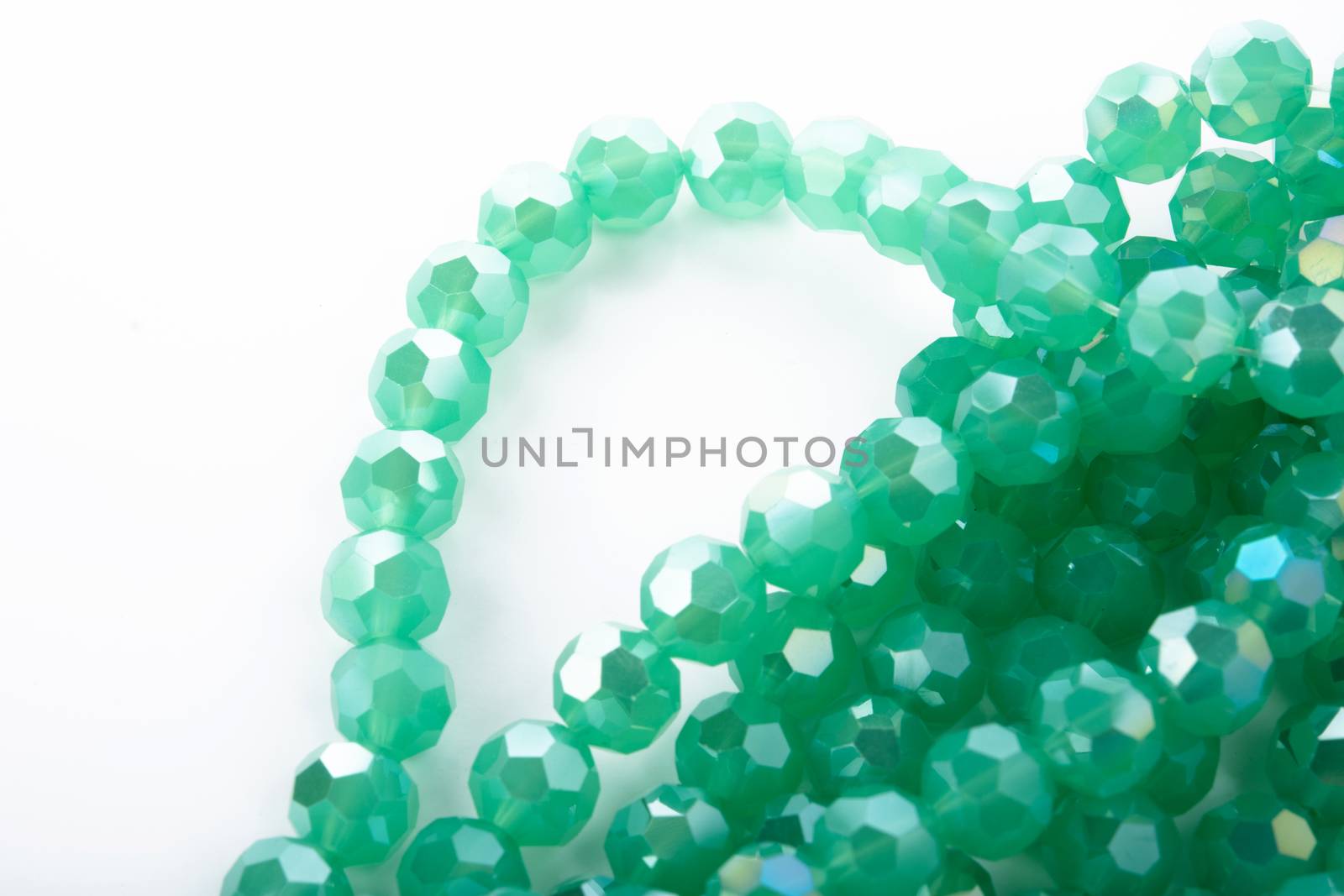 Beautiful Light green Glass Sparkle Crystal Isoalted Beads on white background. Use for diy beaded jewelry