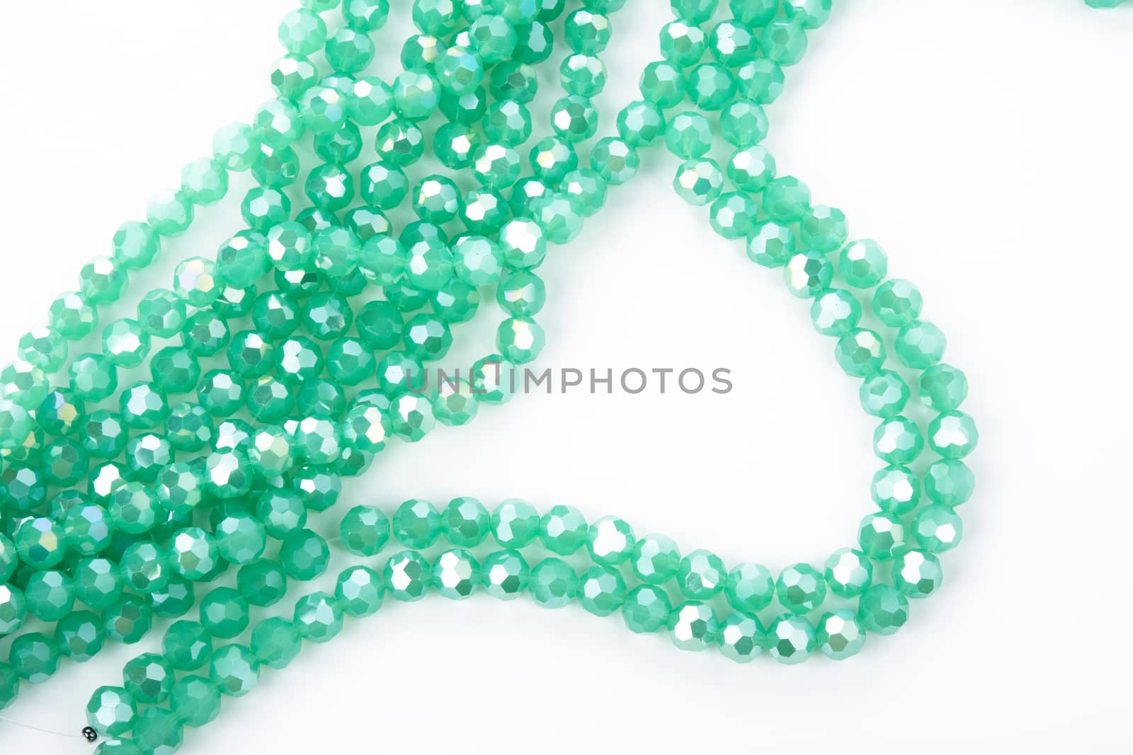 Beautiful Light green Glass Sparkle Crystal Isoalted Beads on white background. Use for diy beaded jewelry