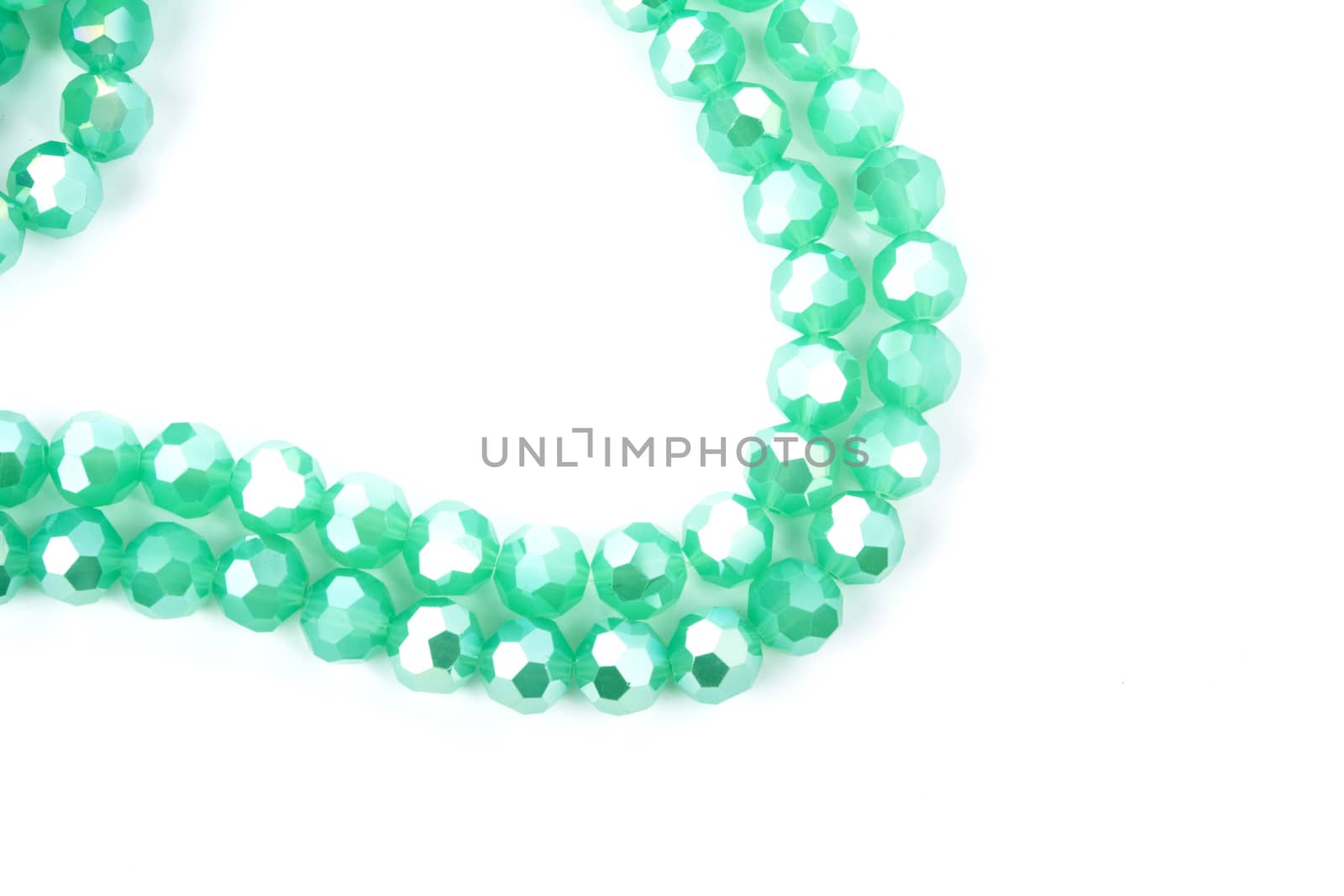 Beautiful Light green Glass Sparkle Crystal Isoalted Beads on white background. Use for diy beaded jewelry