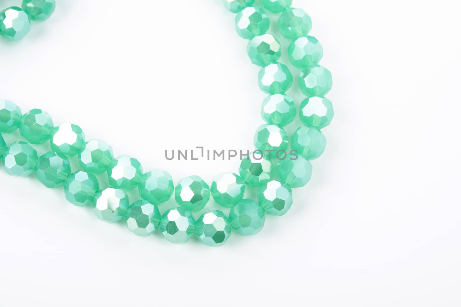 Beautiful Light green Glass Sparkle Crystal Isoalted Beads on white background. Use for diy beaded jewelry