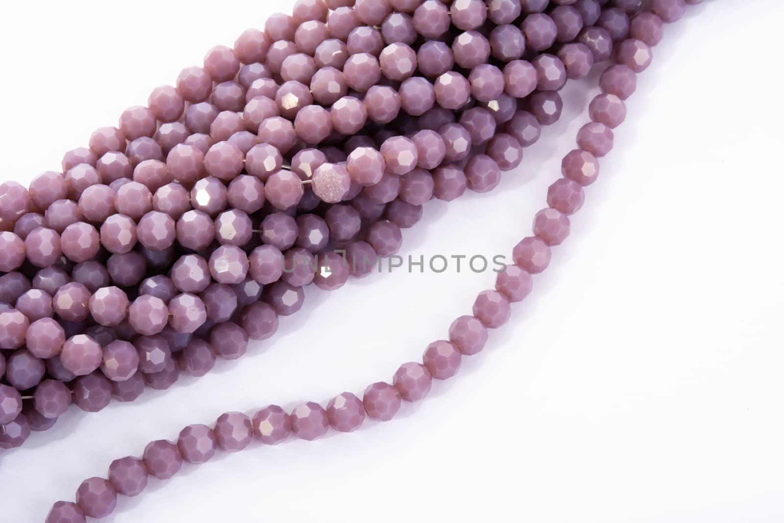 Beautiful Light purple Glass Sparkle Crystal Isoalted Beads on white background. Use for diy beaded jewelry