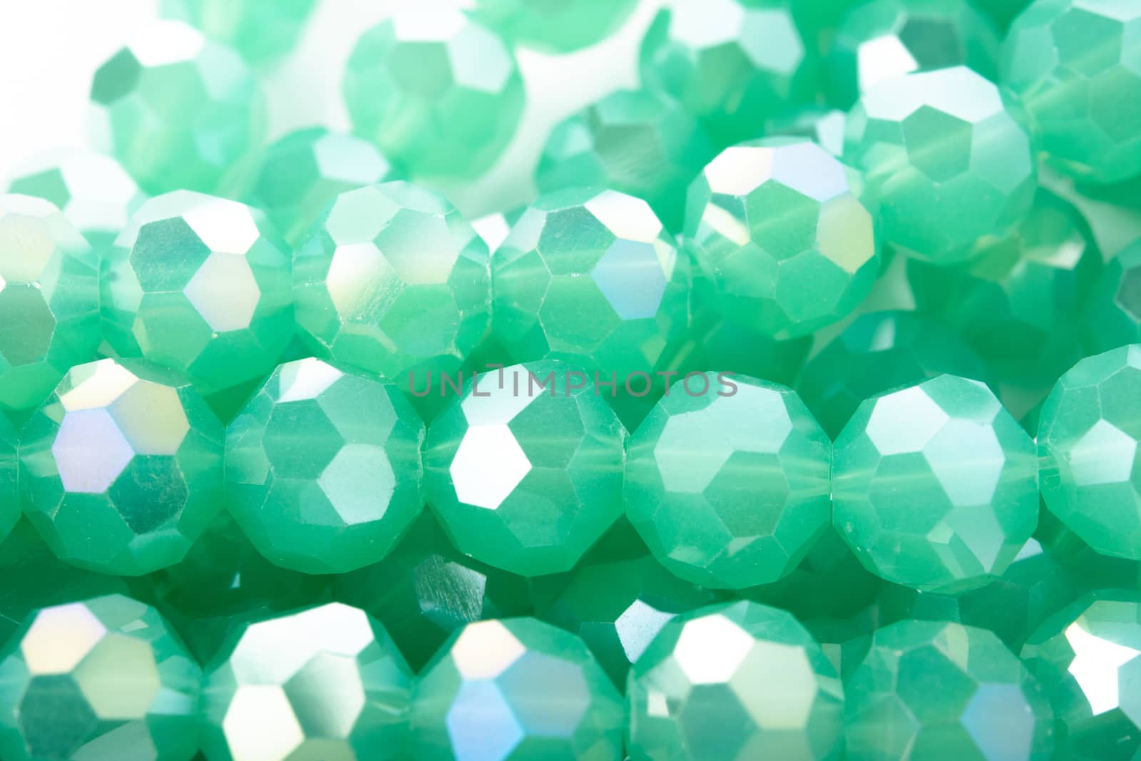 Beautiful Light green Glass Sparkle Crystal Isoalted Beads on white background. Use for diy beaded jewelry