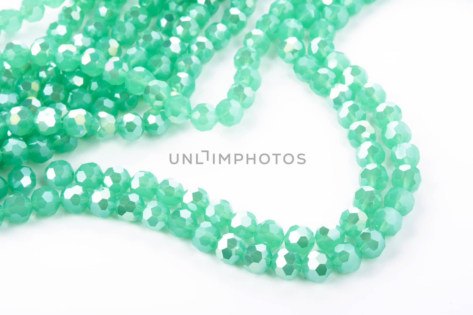 Beautiful Light green Glass Sparkle Crystal Isoalted Beads on white background. Use for diy beaded jewelry