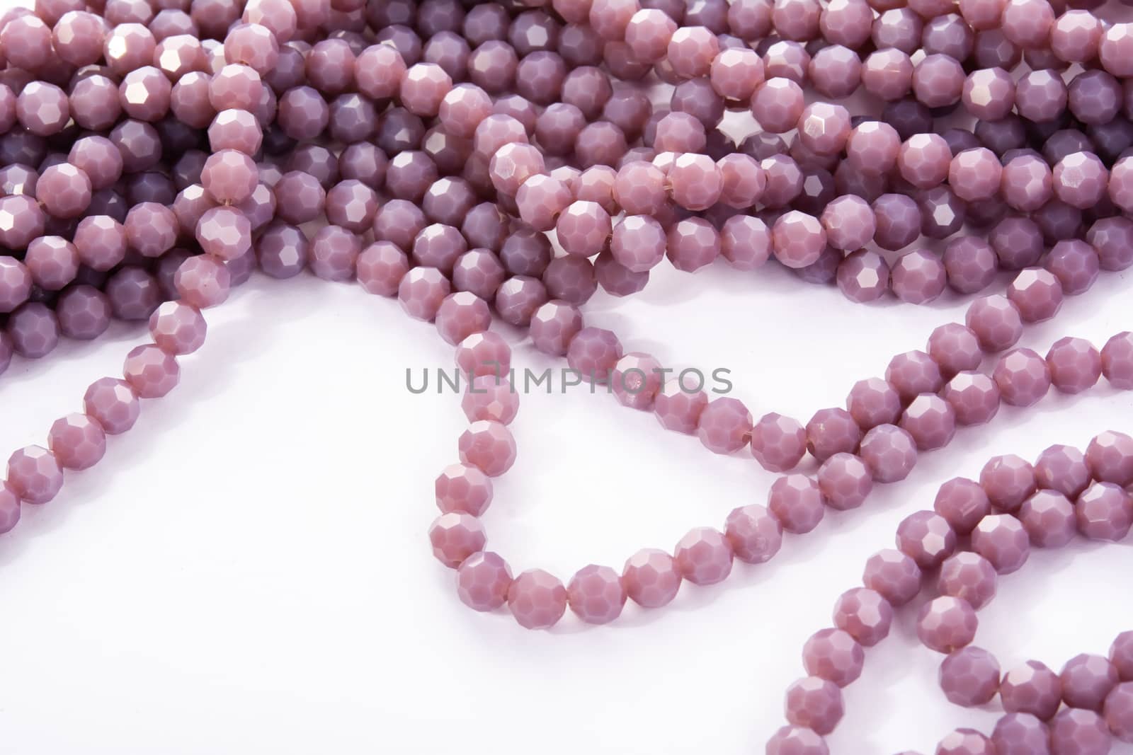 Beautiful Light purple Glass Sparkle Crystal Isoalted Beads on white background. Use for diy beaded jewelry