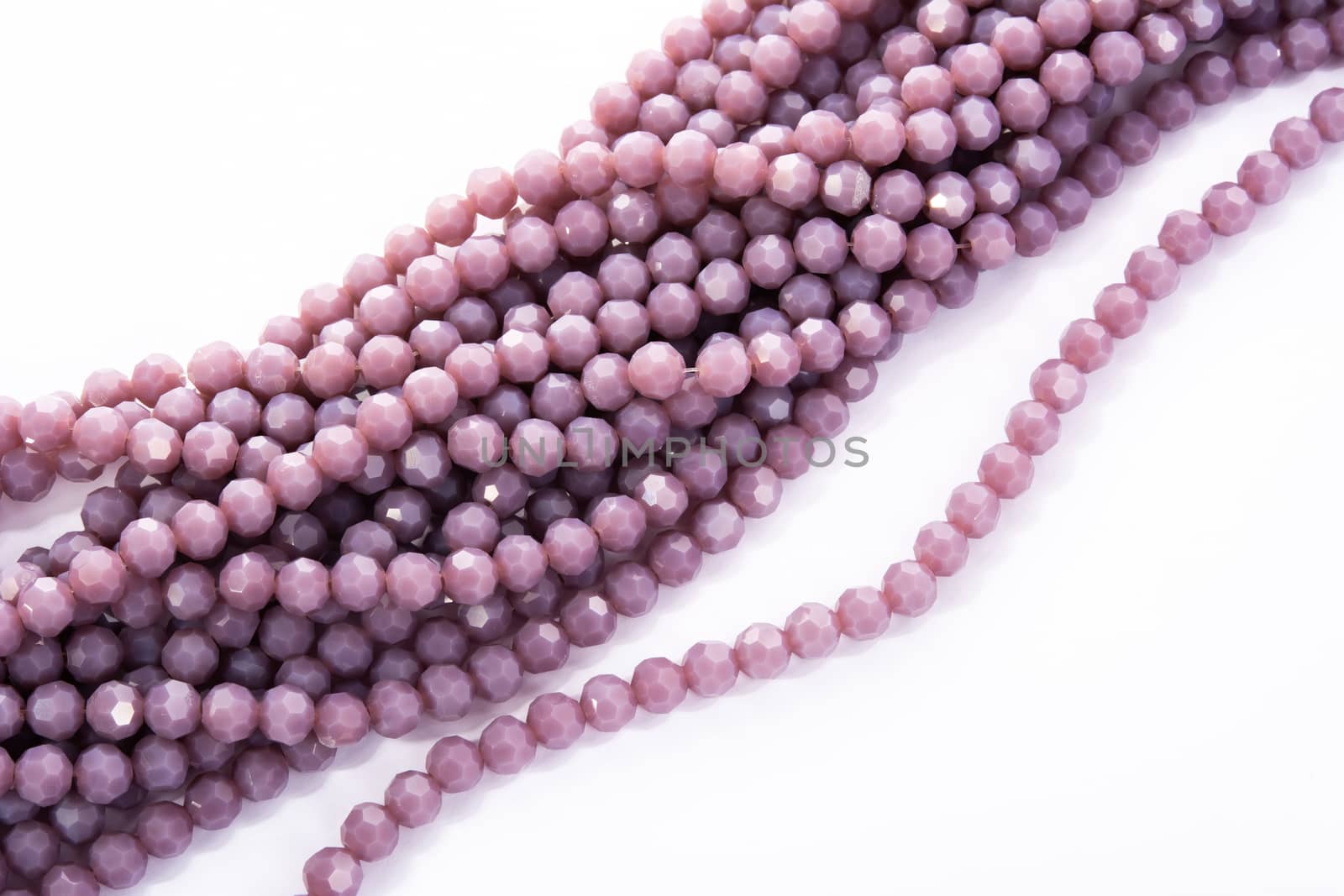 Beautiful Light purple Glass Sparkle Crystal Isoalted Beads on white background. Use for diy beaded jewelry