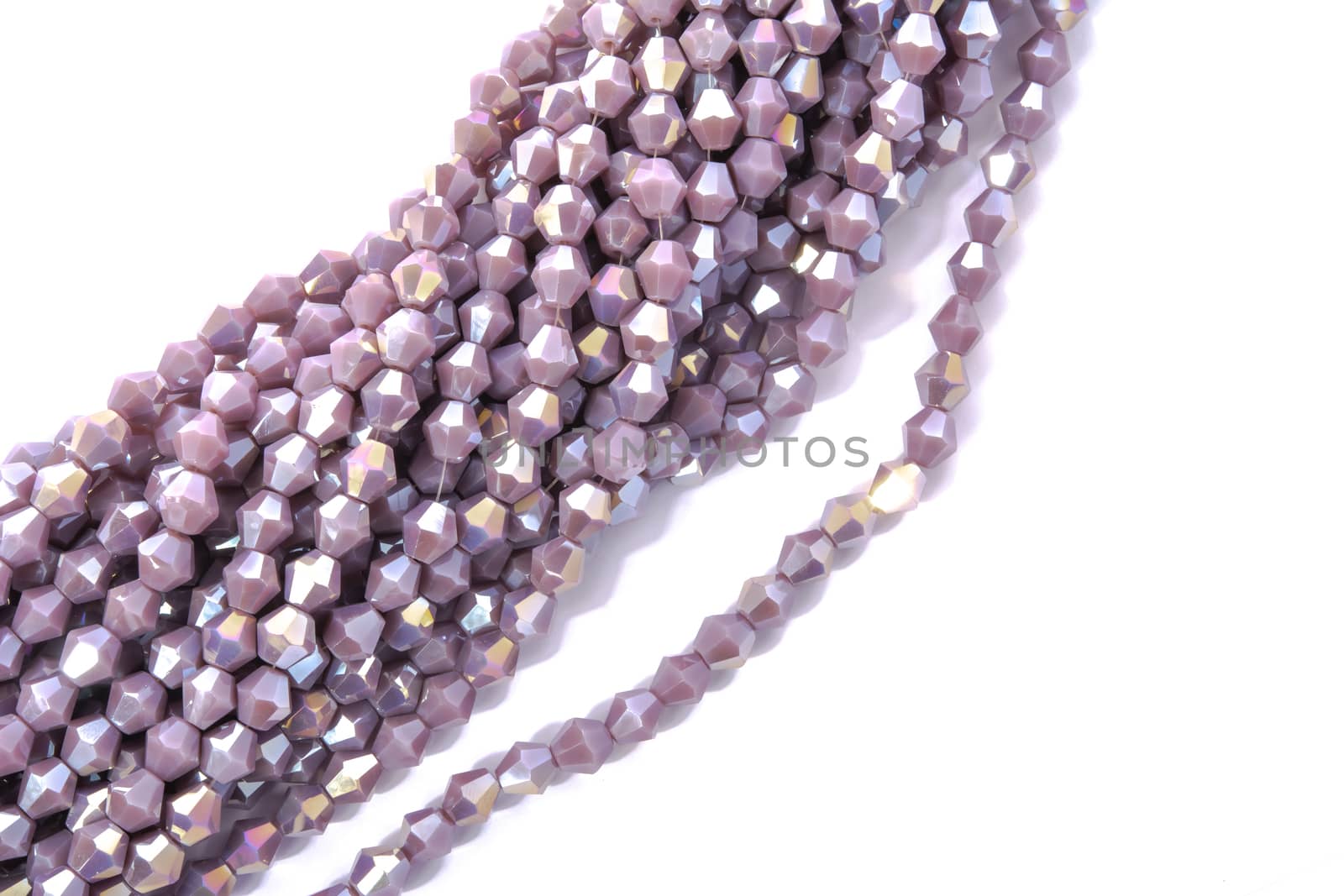 Beautiful Light purple Glass Sparkle Crystal Isoalted Beads on white background. Use for diy beaded jewelry