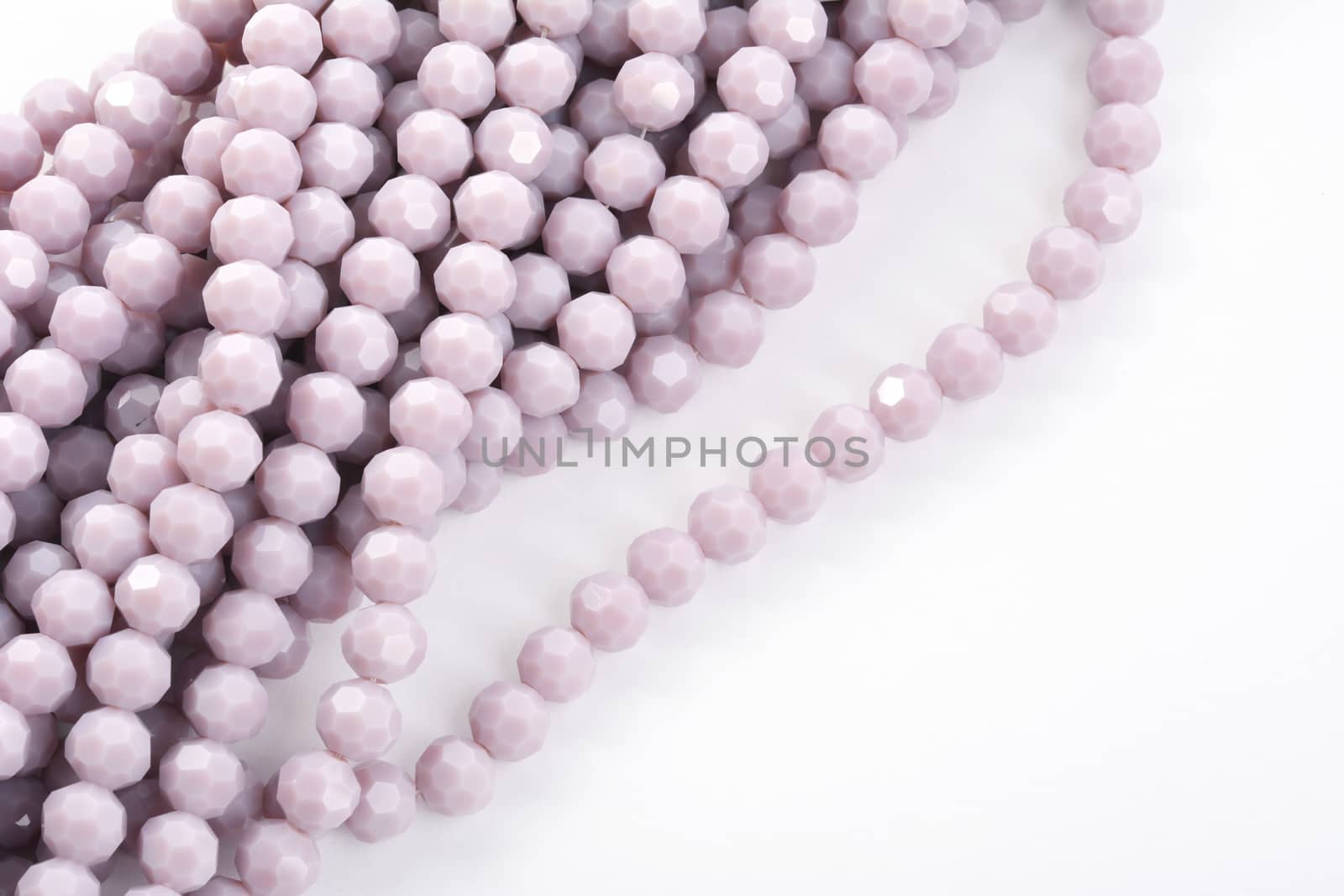 Beautiful Light purple Glass Sparkle Crystal Isoalted Beads on white background. Use for diy beaded jewelry