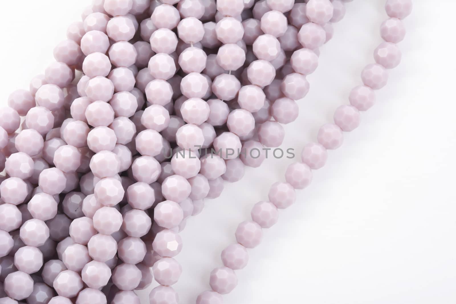 Beautiful Light purple Glass Sparkle Crystal Isoalted Beads on white background. Use for diy beaded jewelry
