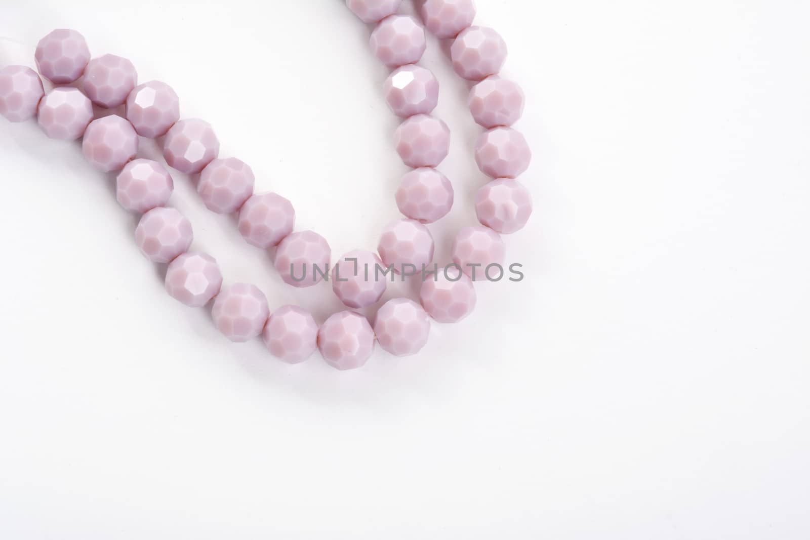 Beautiful Light purple Glass Sparkle Crystal Isoalted Beads on white background. Use for diy beaded jewelry