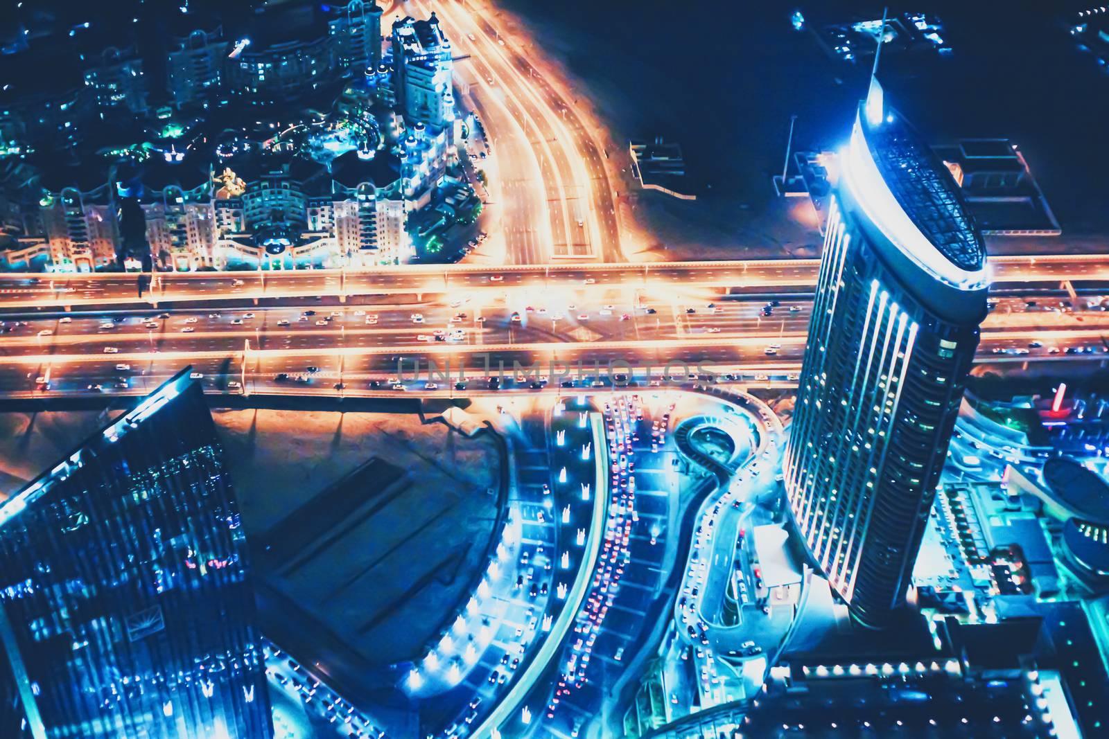 Aerial night view of Dubai in United Arab Emirates, metropolitan cityscape scenery