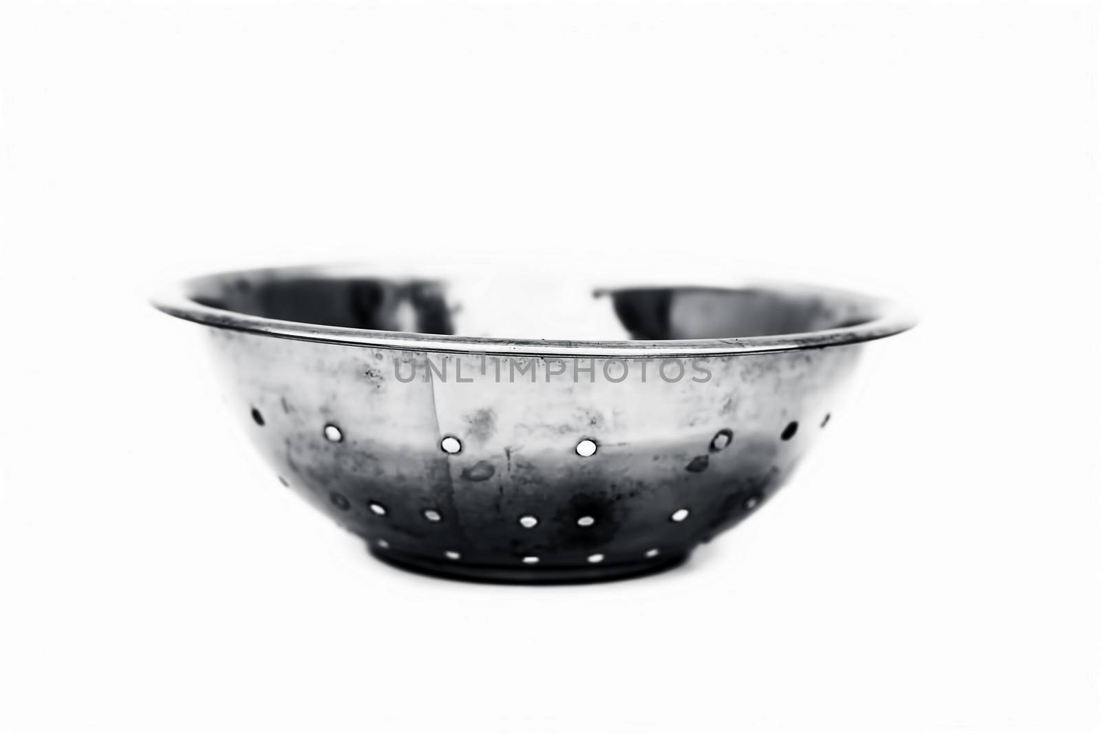 Close up of circular domestic stainless steel container isolated on white used to store, preserve etc.