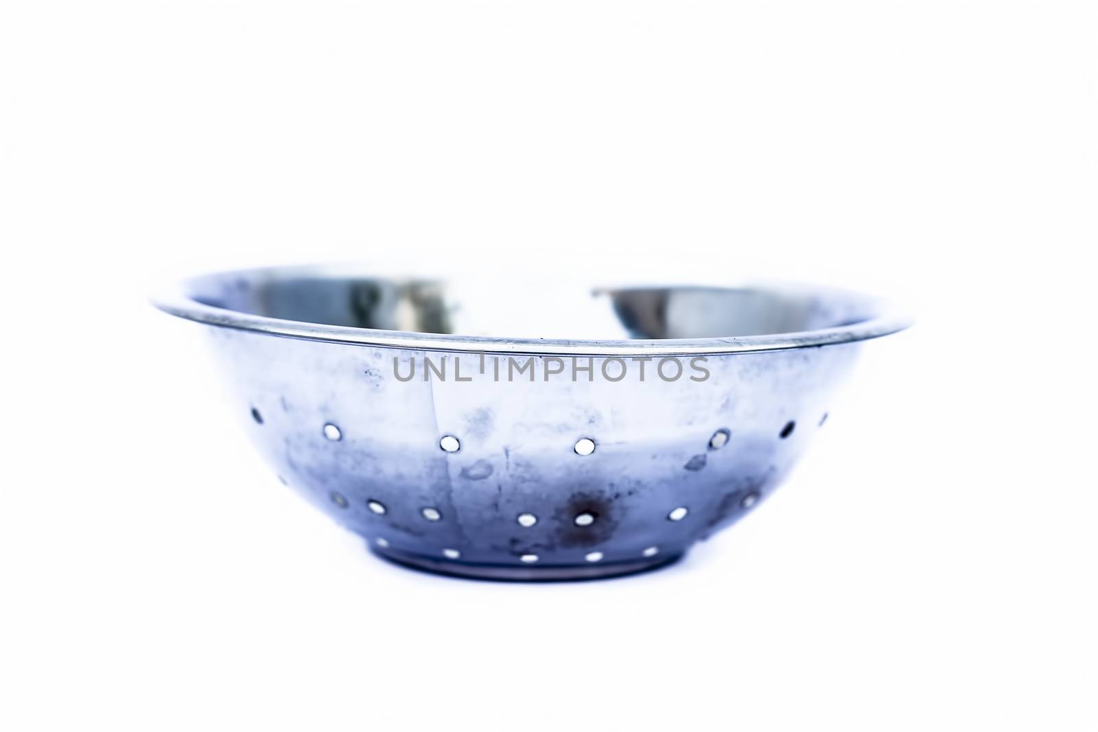 Close up of circular domestic stainless steel container isolated on white used to store, preserve etc.