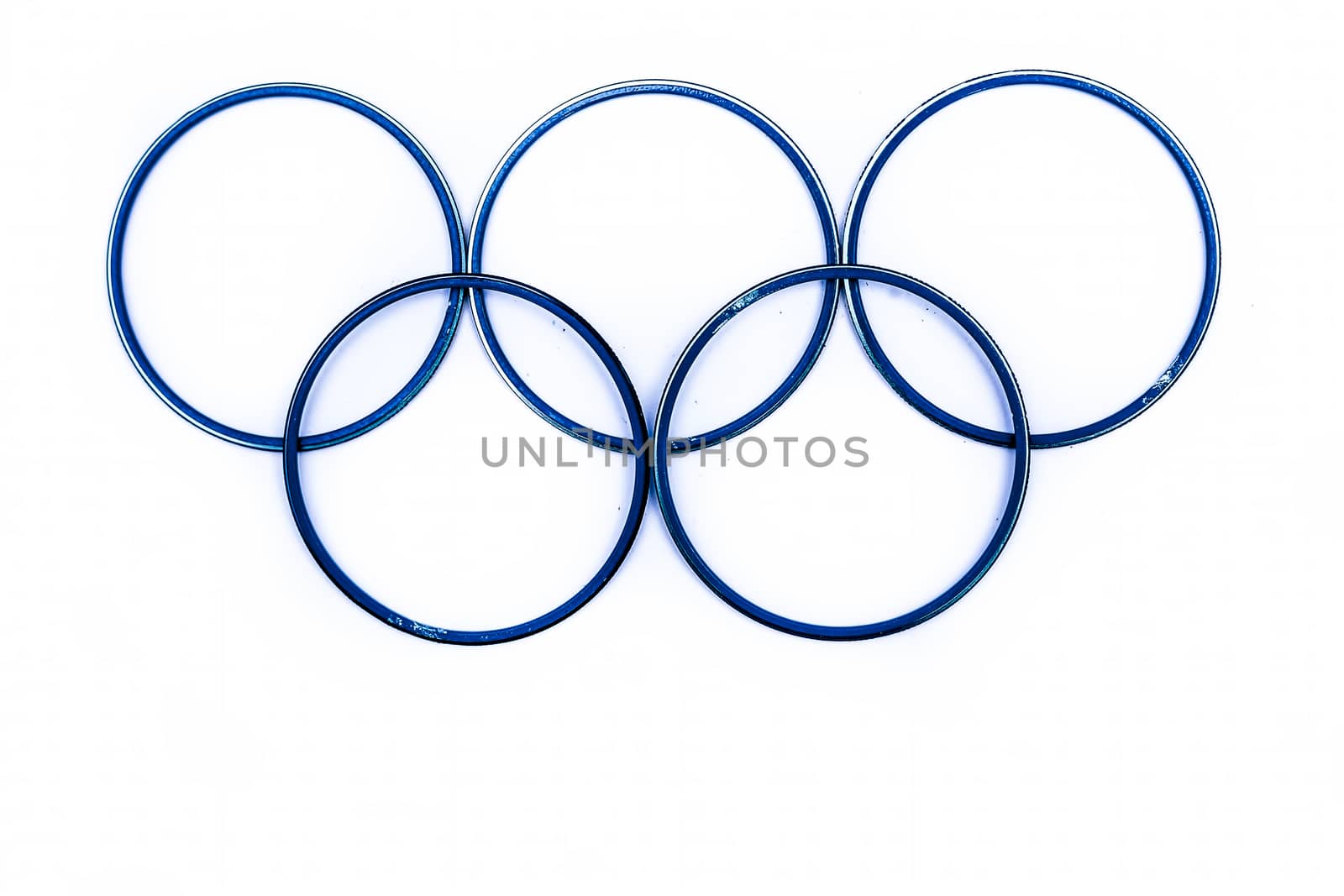 Close up of blue colored bangles forming Olympic symbol isolated on white.