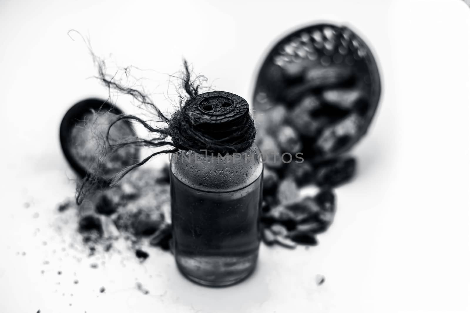 Raw organic dried dates in a hamper with its extracted oil and its powder in a clay bowl isolated on white which widely used in flavored beverages almost entire Asia. by mirzamlk