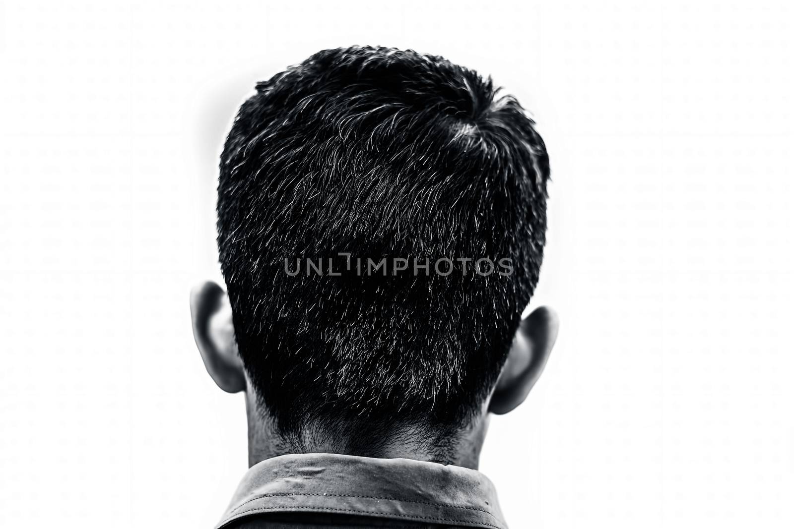 Backside shot of a young teenager affected by premature Grey isolated on white. by mirzamlk