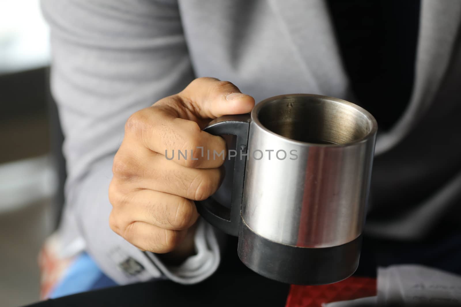 Male hand with cup