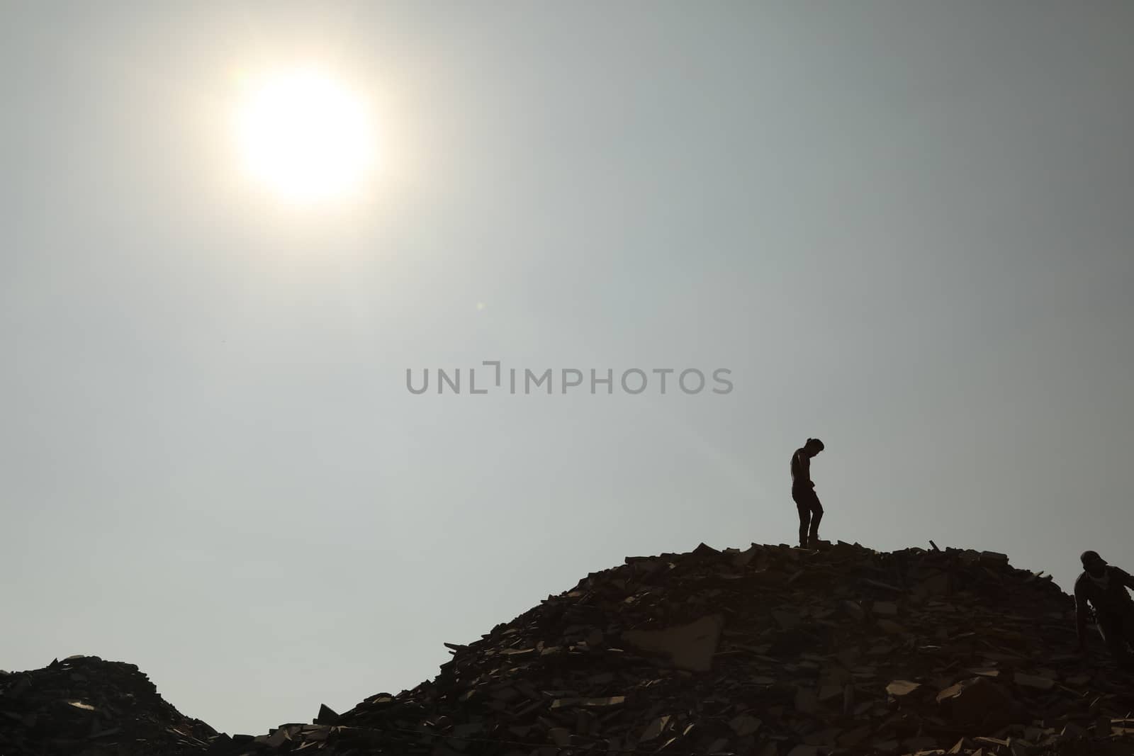 Silhouette of people on hill