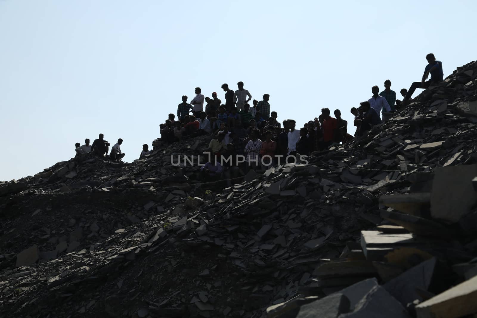 Silhouette of people on hill
