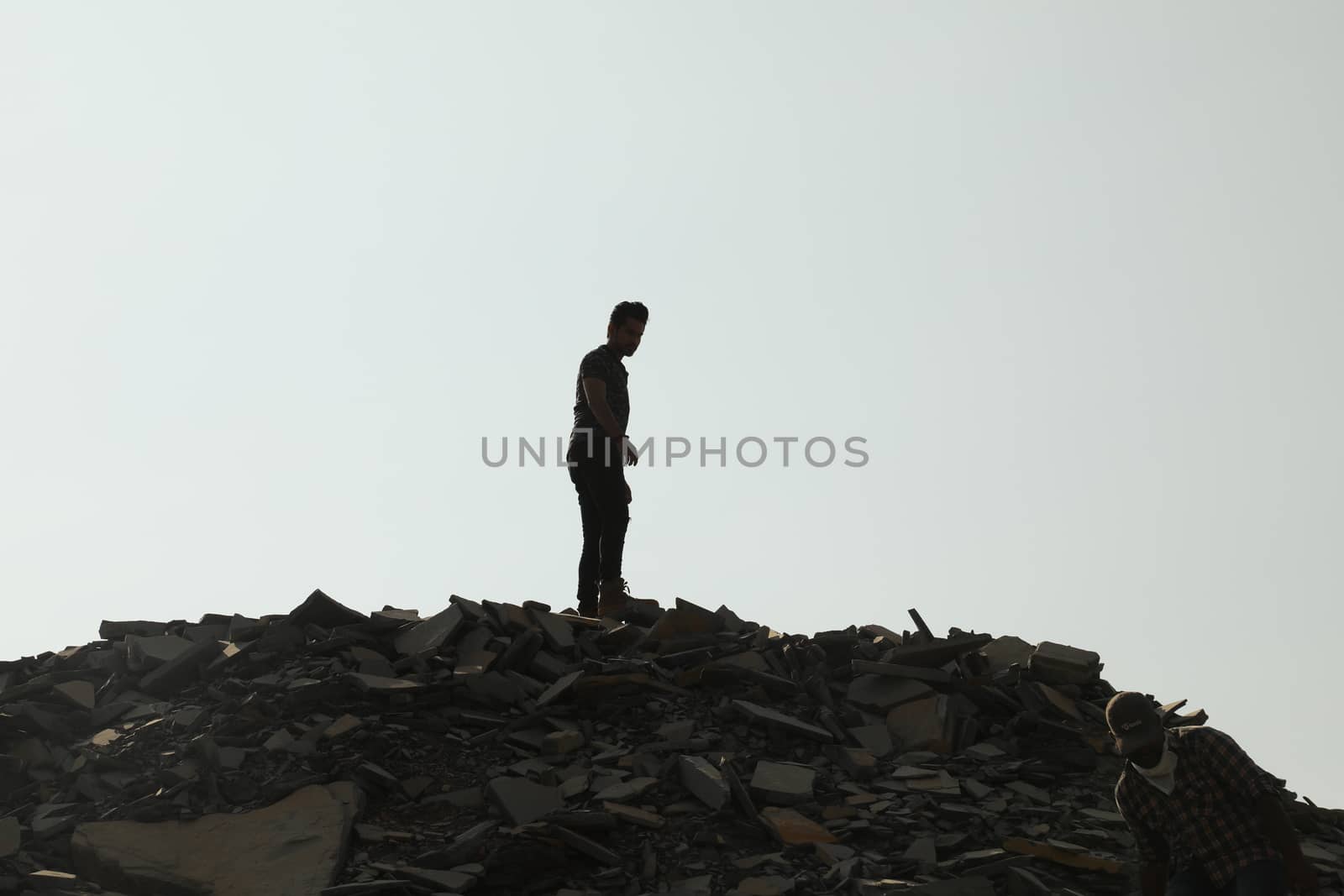 Silhouette of people on hill