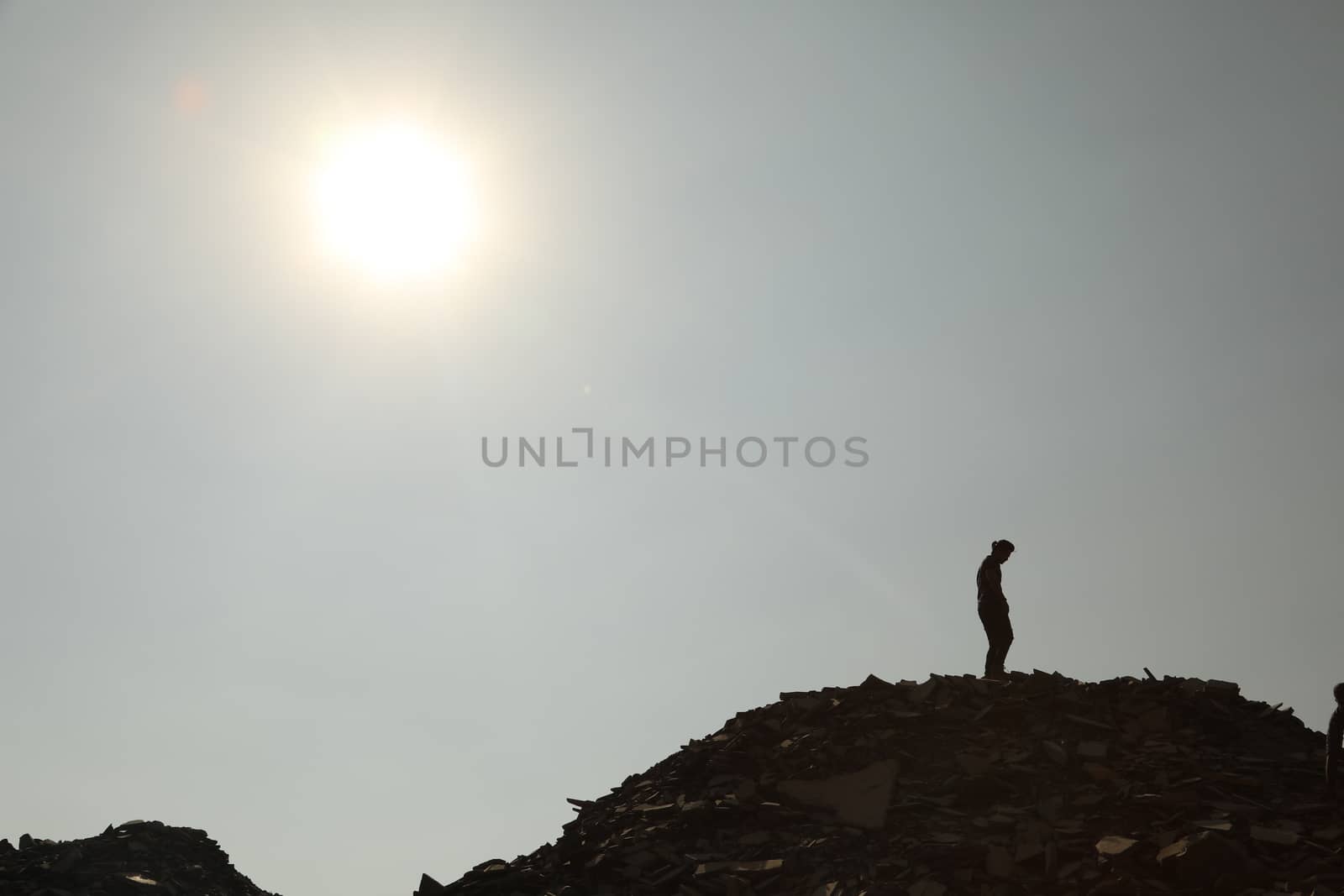 Silhouette of people on hill