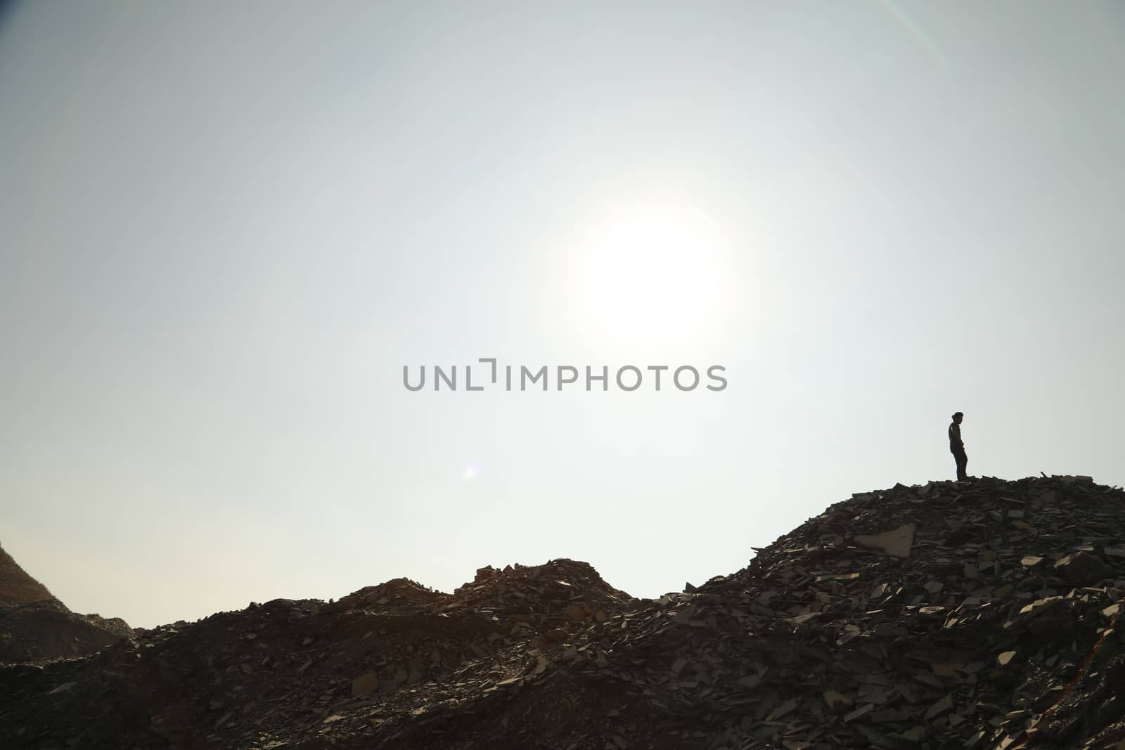 Silhouette of people on hill