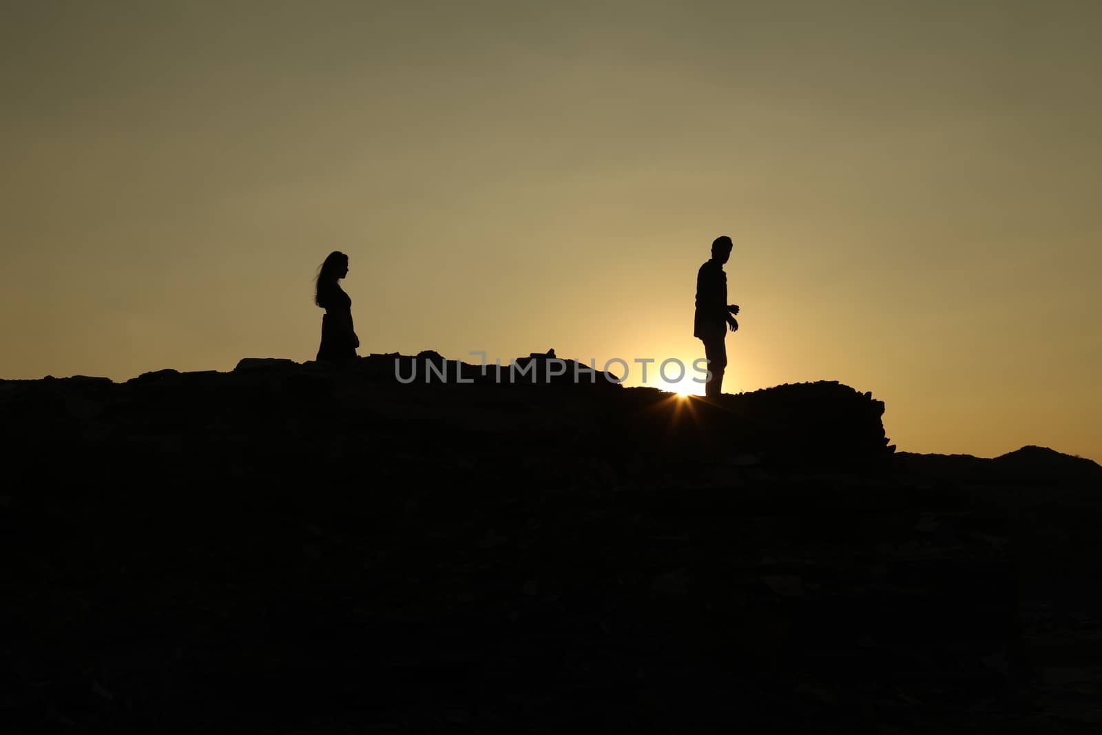 Silhouette of people on hill