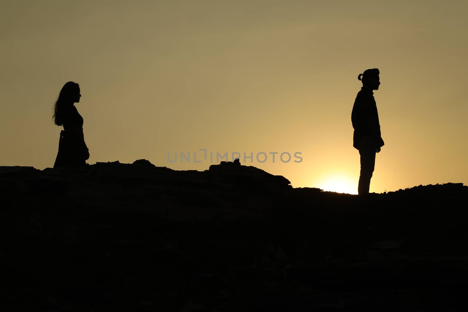 Silhouette of people on hill