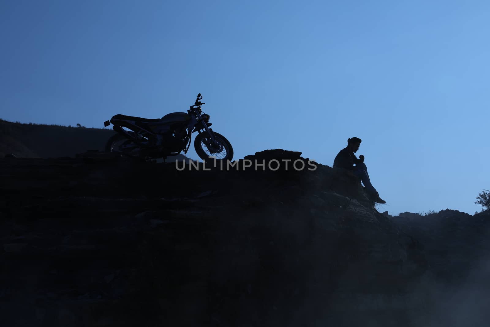 Silhouette of people on hill