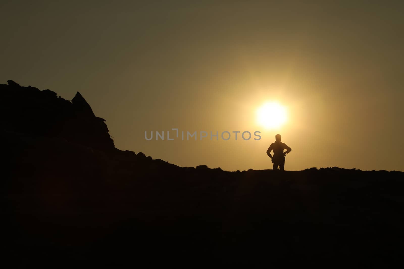 Silhouette of people on hill