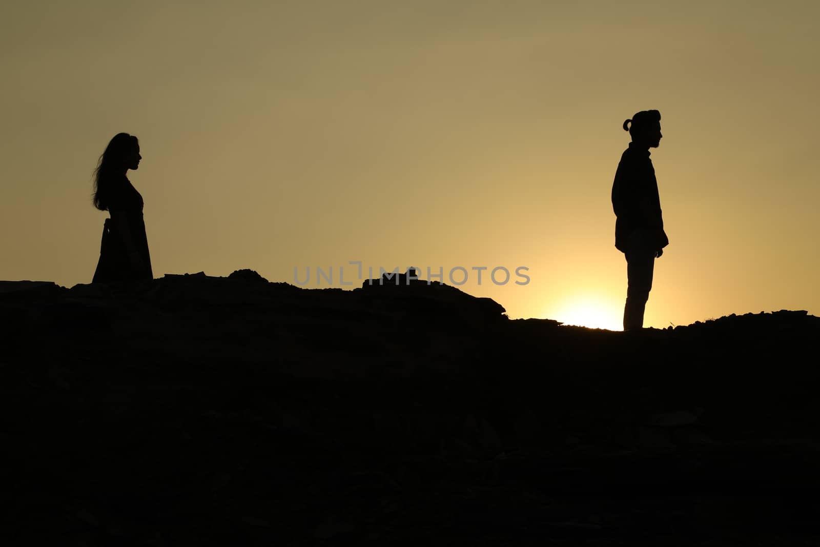Silhouette of people on hill
