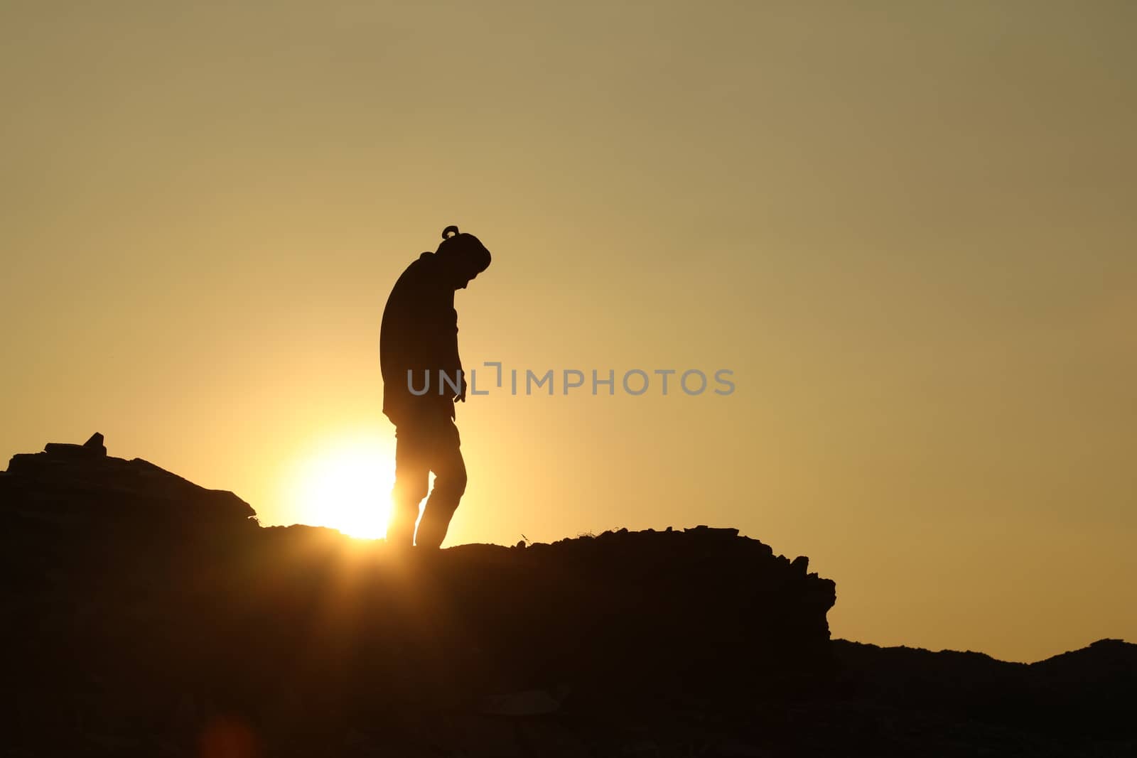 Silhouette of people on hill
