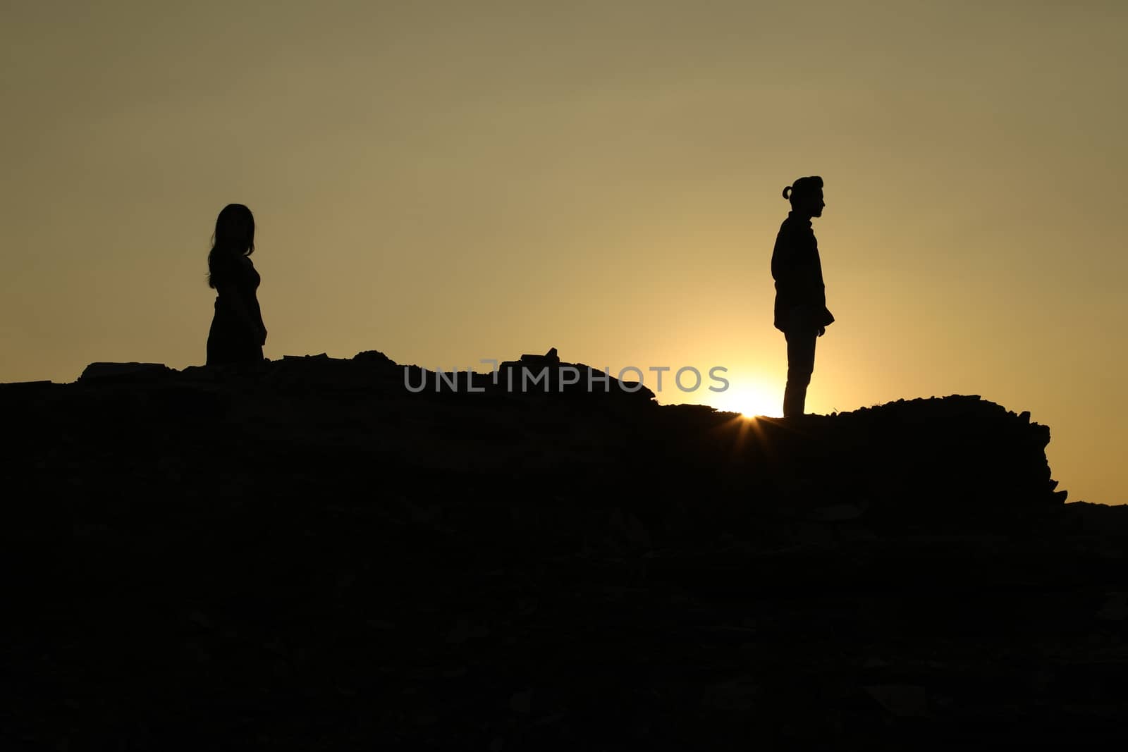 Silhouette of people on hill