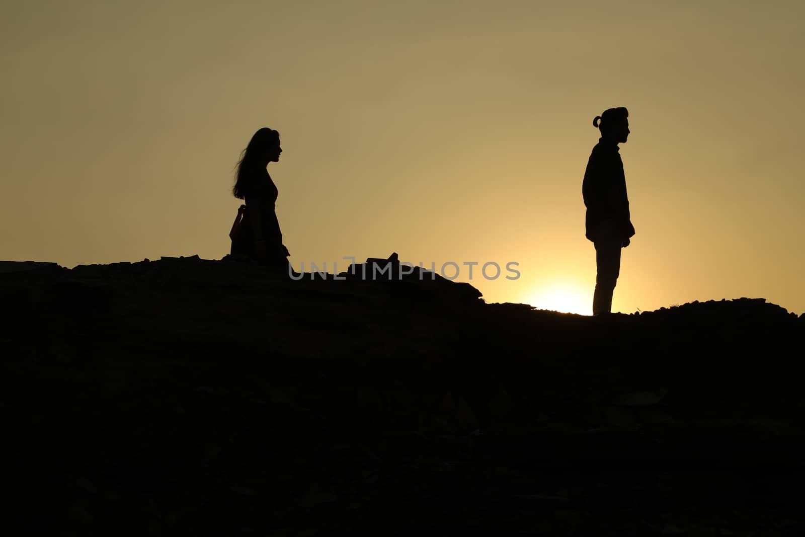 Silhouette of people on hill