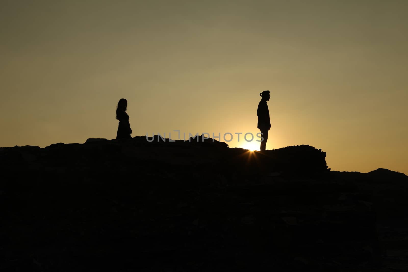 Silhouette of people on hill