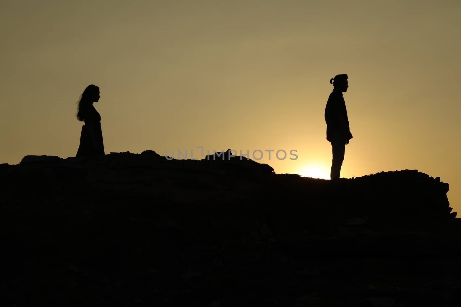 Silhouette of people on hill