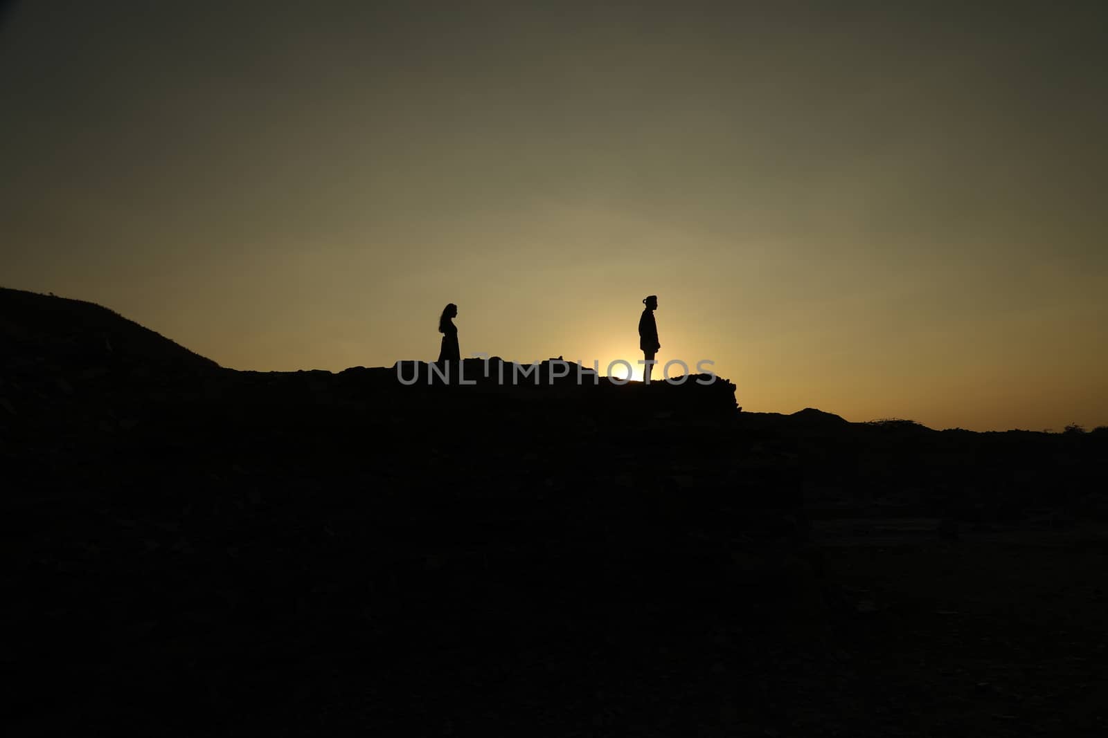 Silhouette of people on hill