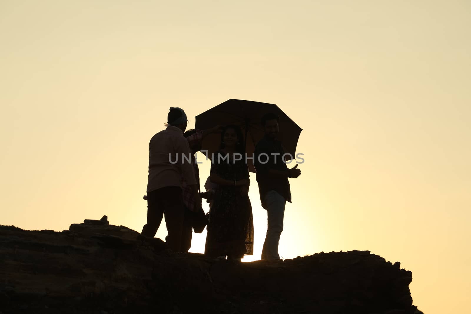 Silhouette of people on hill