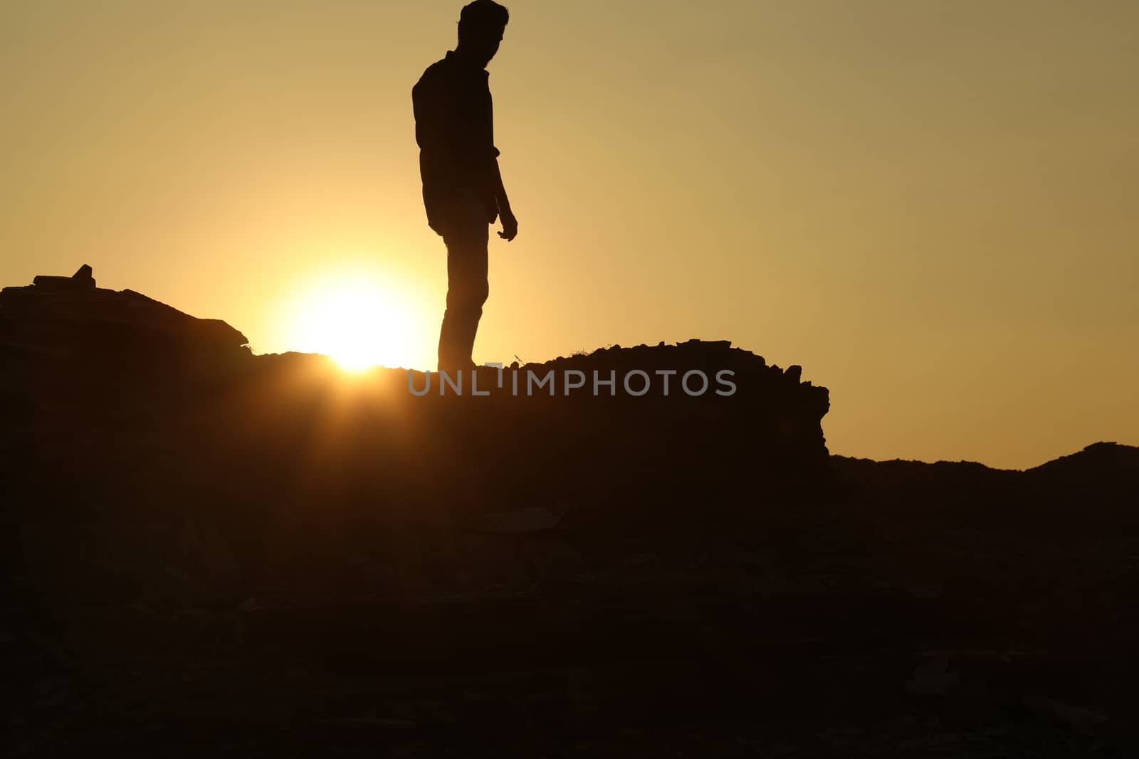 Silhouette of people on hill