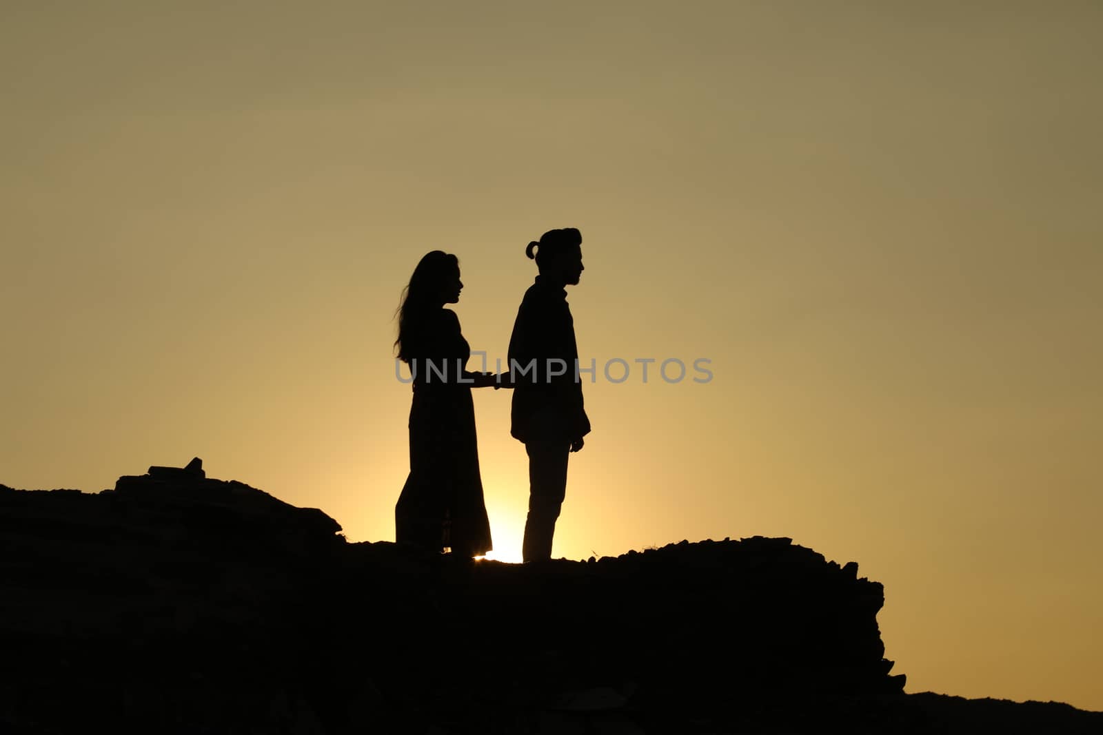 Silhouette of people on hill