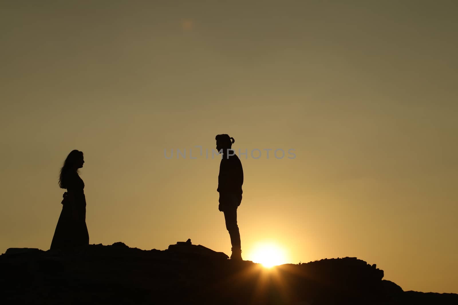 Silhouette of people on hill