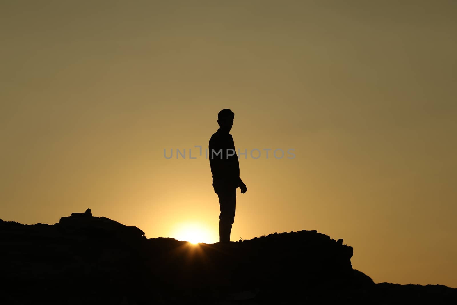 Silhouette of people on hill