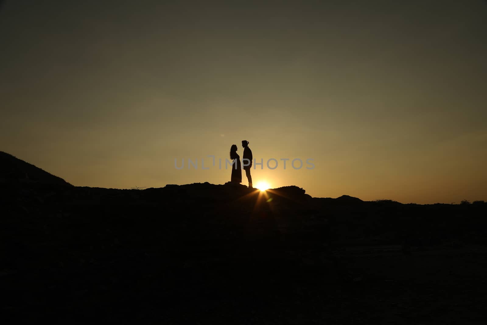 Silhouette of people on hill