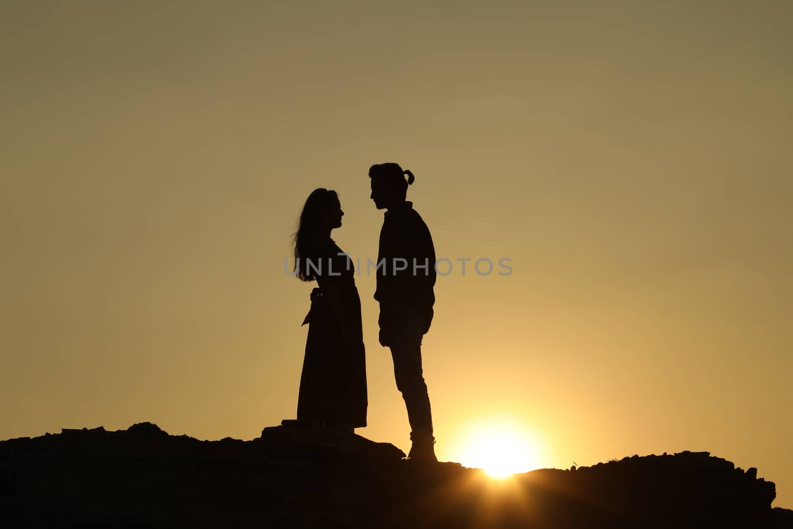 Silhouette of people on hill