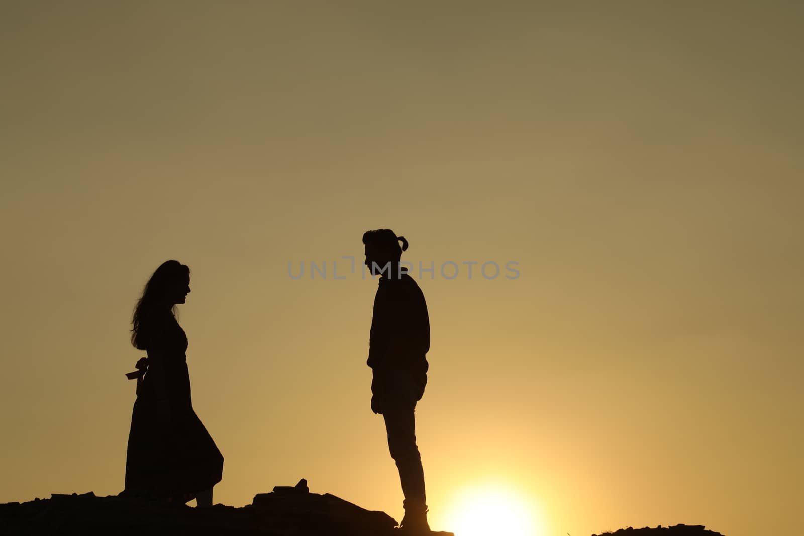 Silhouette of people on hill