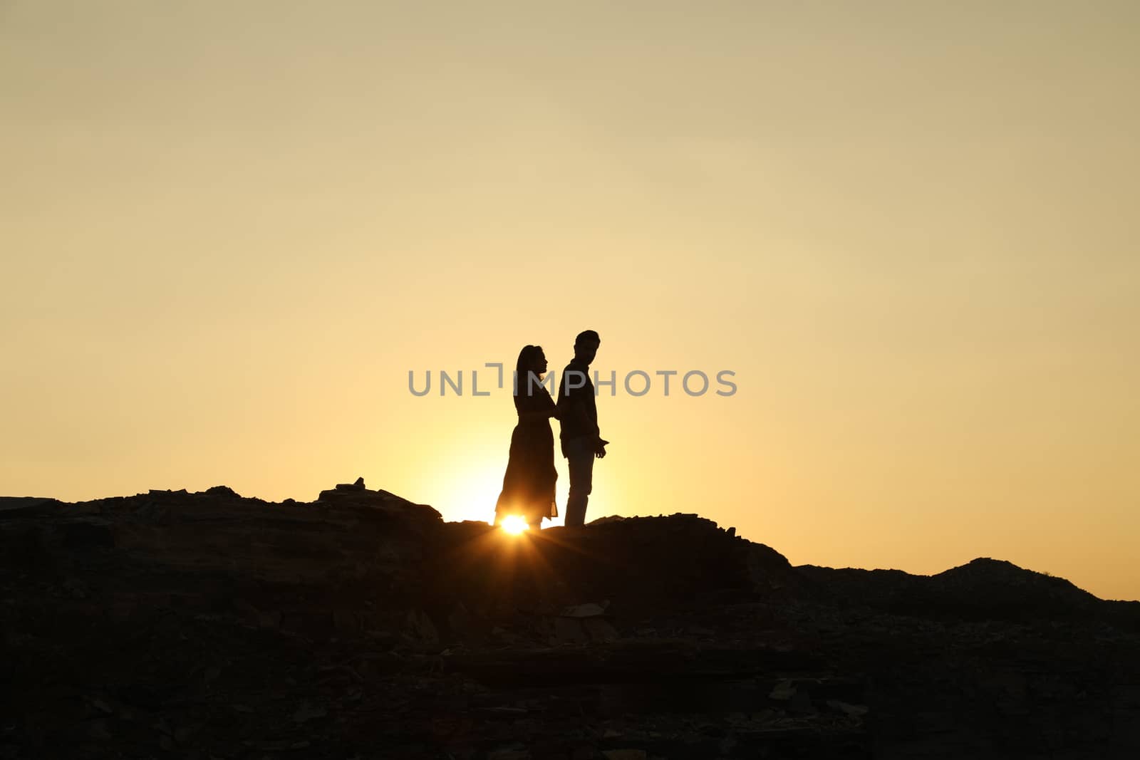 Silhouette of people on hill
