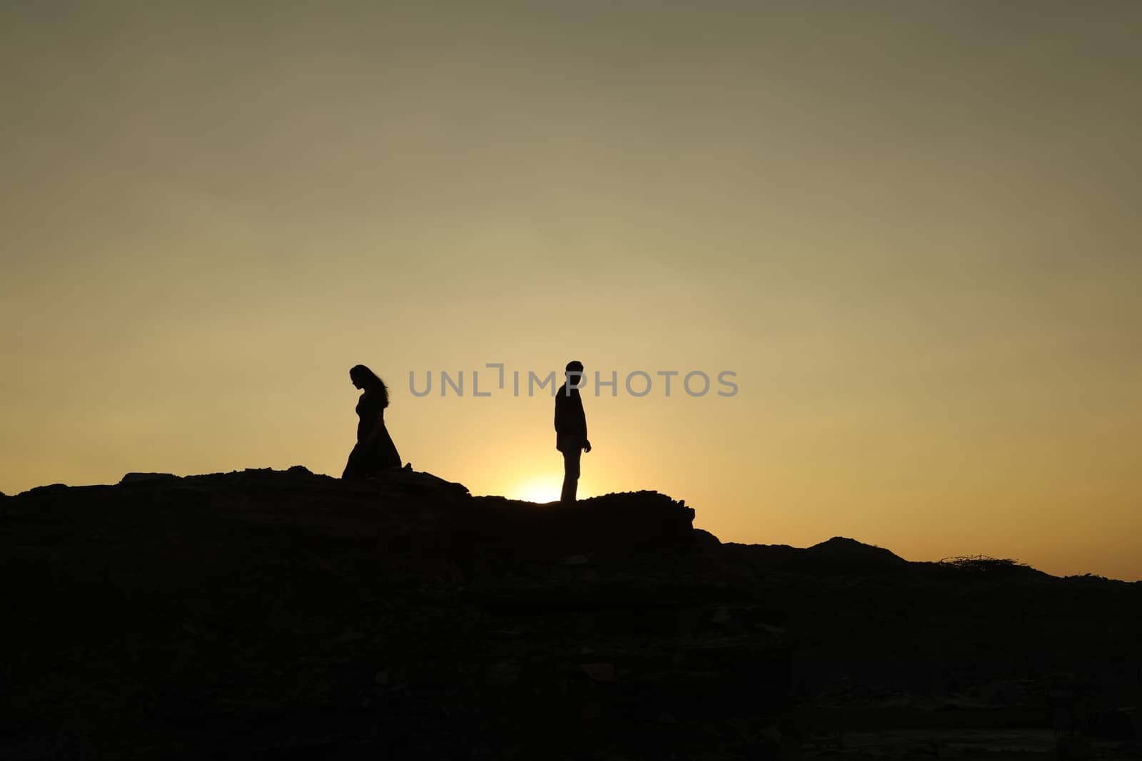 Silhouette of people on hill