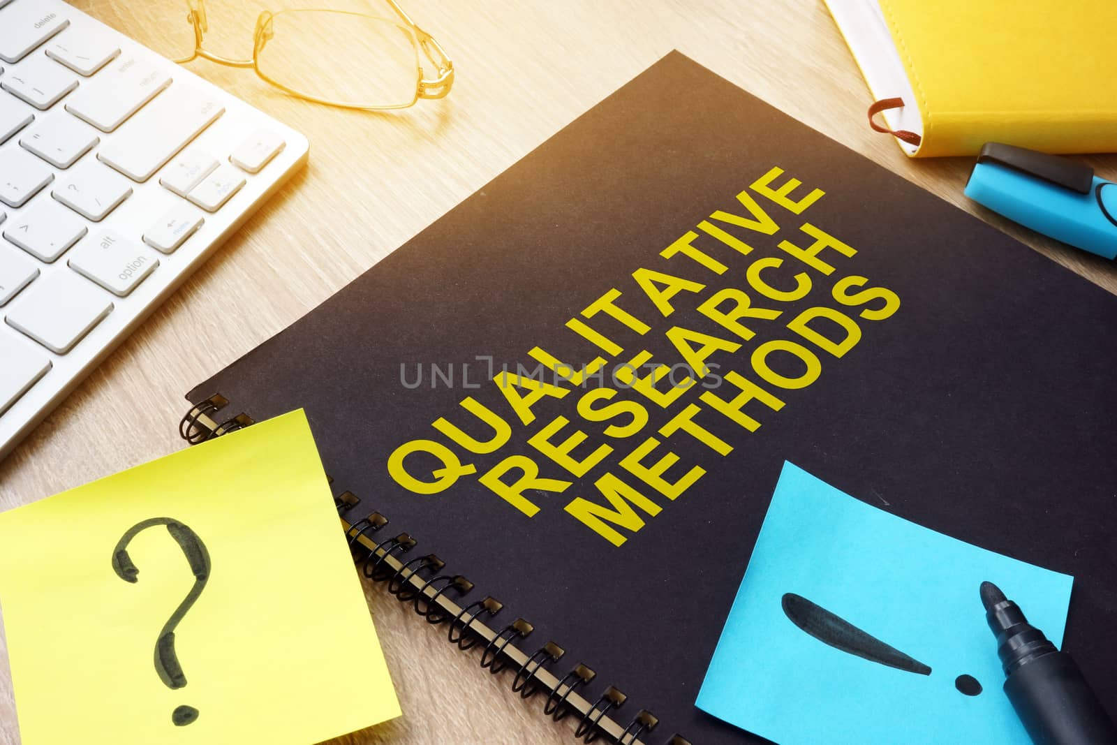 Qualitative research methods and sticks on a desk.