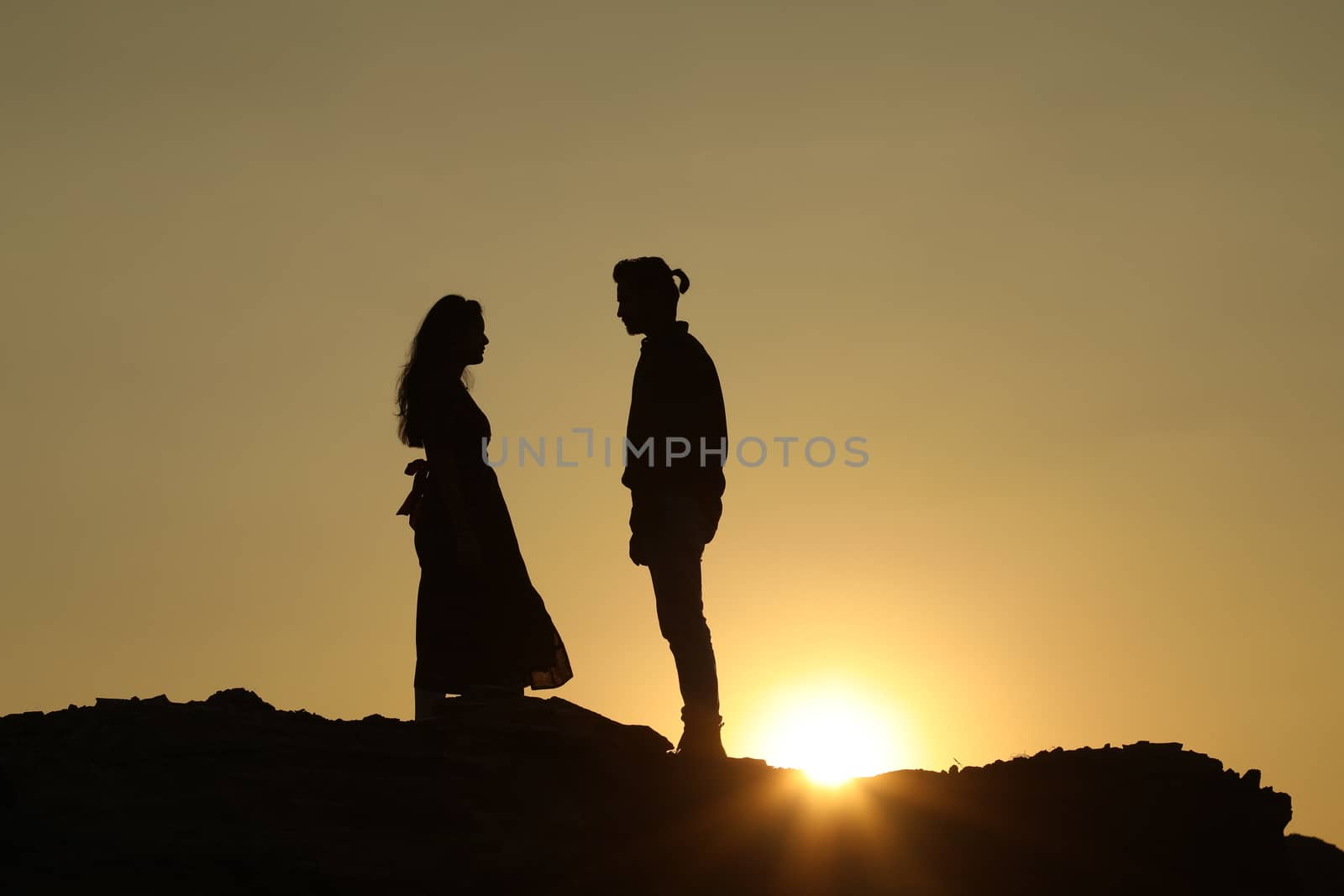 Silhouette of people on hill