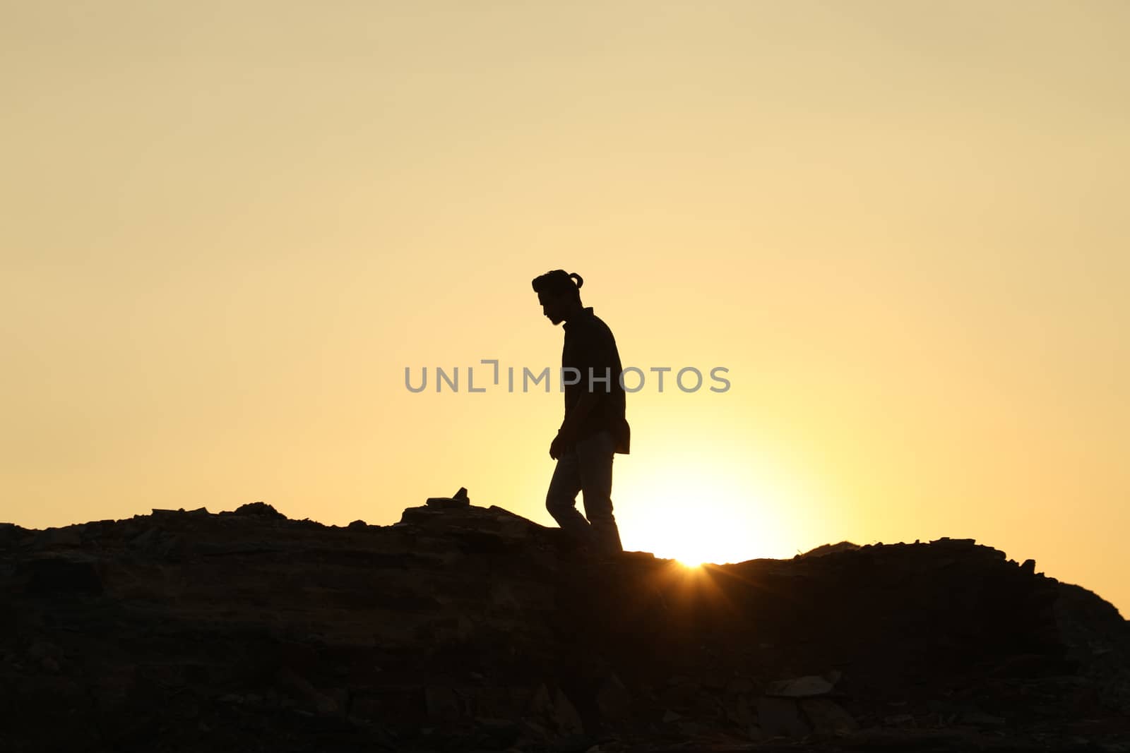 Silhouette of people on hill